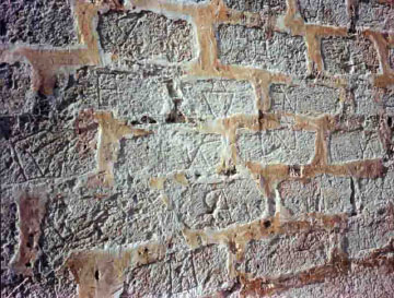 Wall in back of San Severino Castle, showing marks made by enslaved builders