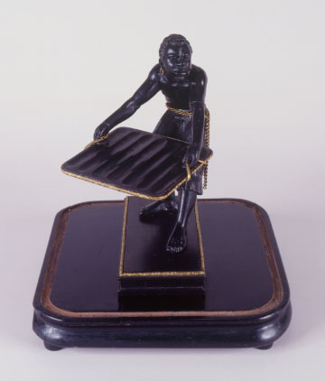 Cigar display in the form of a slave statuette
